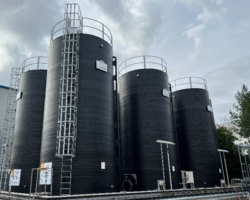 Three large thermoplastic chemical storage tanks